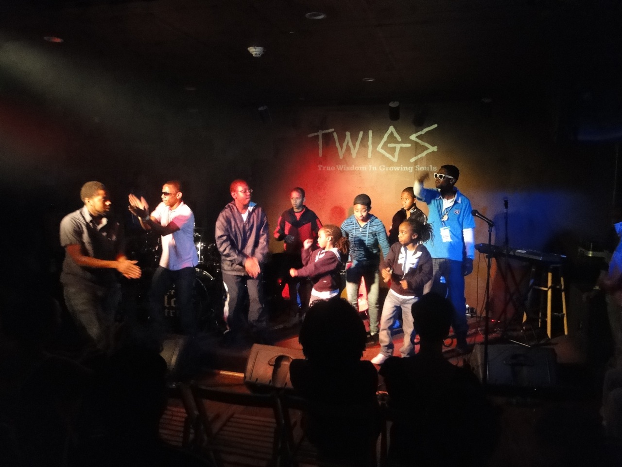 Young people and mentors sharing the T.W.I.G.S. stage together.