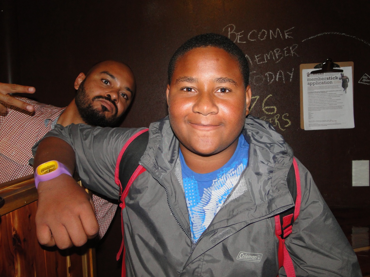 A young T.W.I.G.S. participant with a Chewstick mentor.